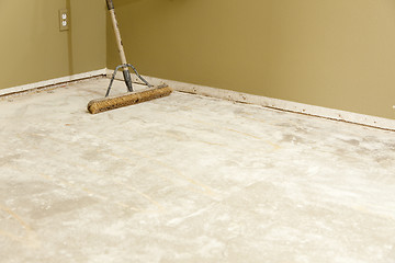 Image showing Concrete House Floor with Broom Ready for Flooring Installation