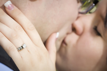 Image showing Female Hand with Engagement Ring Touching Fiance's Face