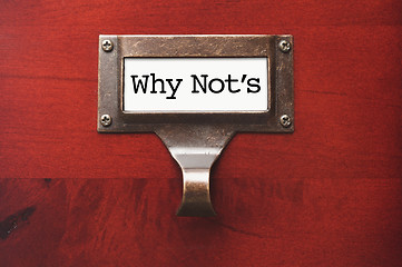 Image showing Lustrous Wooden Cabinet with Why Not's File Label