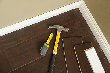 Image showing Hammer, Laminate Flooring and New Baseboard Molding