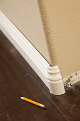 Image showing New Baseboard and Bull Nose Corners with Laminate Flooring