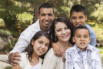 Image showing Happy Attractive Hispanic Family Portrait In the Park