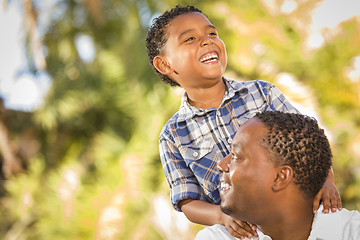 Image showing Happy Mixed Race Father and Son Playing