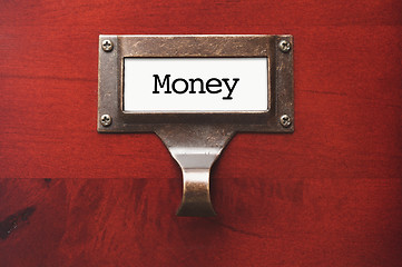 Image showing Lustrous Wooden Cabinet with Money File Label