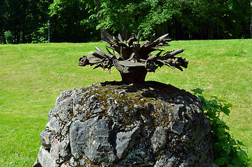 Image showing vintage retro fountain steel flower mossy stones 