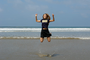 Image showing jumping girl on the beach