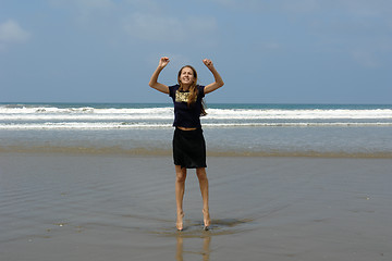 Image showing jumping girl on the beach