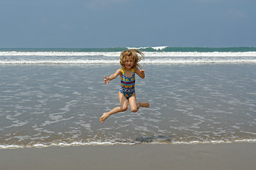 Image showing jumping child on the beach