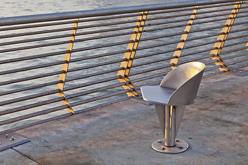 Image showing metal chair at waterfornt