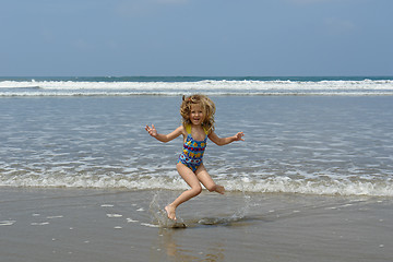 Image showing jumping child on the beach