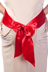 Image showing Pregnant Woman's Belly with Red Ribbon