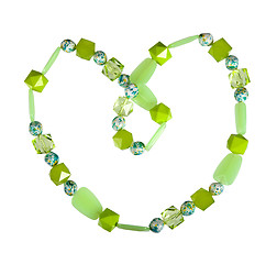 Image showing Beads of green glass on a white background