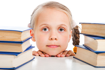 Image showing  girl  between the books on isolated white