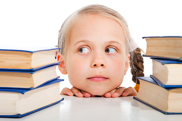 Image showing girl  choosing the books on isolated white