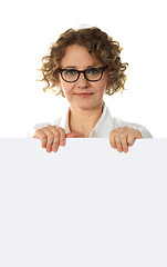 Image showing Aged woman behind big blank white banner ad