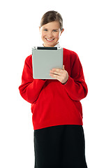 Image showing Confident girl using wireless portable device