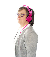 Image showing Aged female listening to music