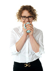 Image showing Female executive drinking coffee