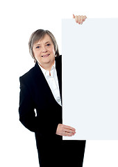 Image showing Female executive holding blank whiteboard