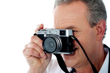 Image showing Closeup view of a male photographer taking photo