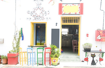 Image showing coffee shop bar with colorful vintage Greece style chairs, stool