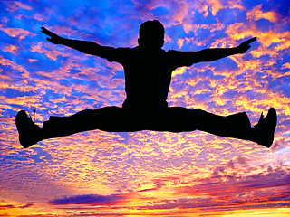 Image showing Boy jumping high in the air