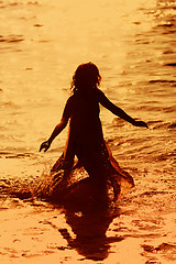 Image showing Girl running in the water