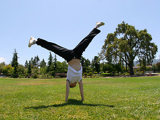 Image showing Cartwheel outdoors