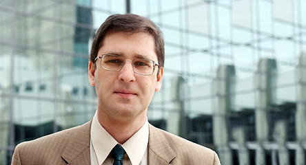 Image showing Young businessman in front of the office building