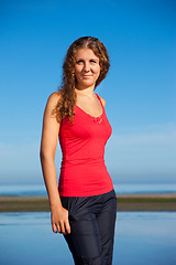 Image showing girl doing morning exercises at the beach