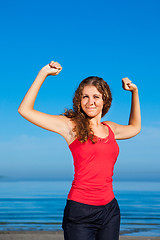 Image showing girl doing morning exercises at the beach