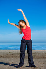 Image showing girl doing morning exercises at the beach