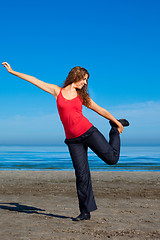 Image showing girl doing morning exercises at the beach