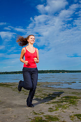 Image showing Beautiful girl running at the beach