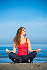 Image showing girl doing morning exercises at the beach