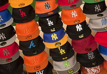 Image showing Baseball caps on market stall