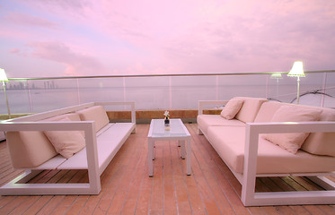 Image showing Stunning view of outdoor chairs and a couch to enjoy the sunset 