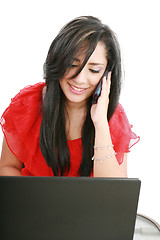 Image showing Portrait of a smiling young business woman speaking on mobile ph