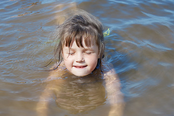 Image showing Baby girl swimming in the river