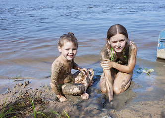 Image showing Children in the mud on the river