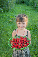 Image showing The little girl with strawberries