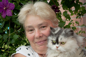 Image showing A housewife and her pet cat