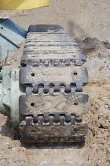 Image showing Caterpillar excavator standing on ground