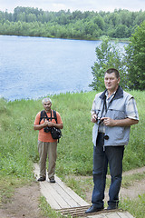 Image showing The tourists on the lake