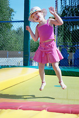 Image showing The little girl  on a trampoline in park
