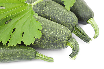 Image showing Four large courgettes