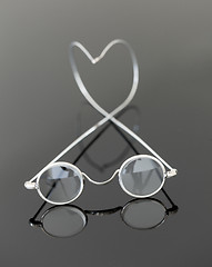 Image showing Pair of old magnifying reading glasses 