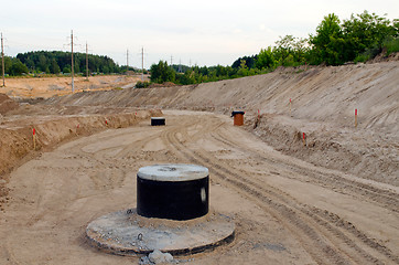 Image showing Road construction.  Gravel  sewage wells 