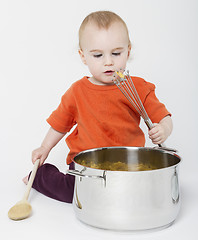 Image showing baby with big cooking pot