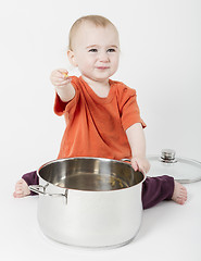 Image showing baby with big cooking pot